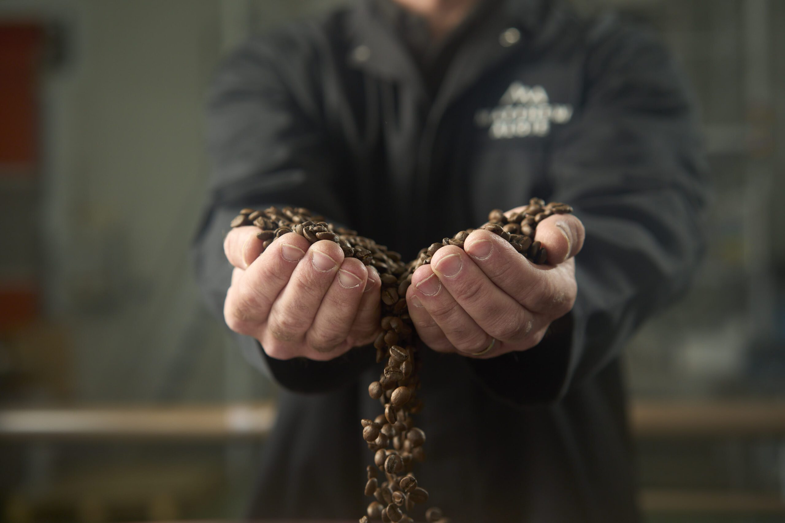 Matthew Algie Coffee master and roaster inspecting roasted coffee