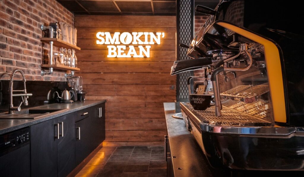 Smokin bean branded cafe design with traditional coffee machine