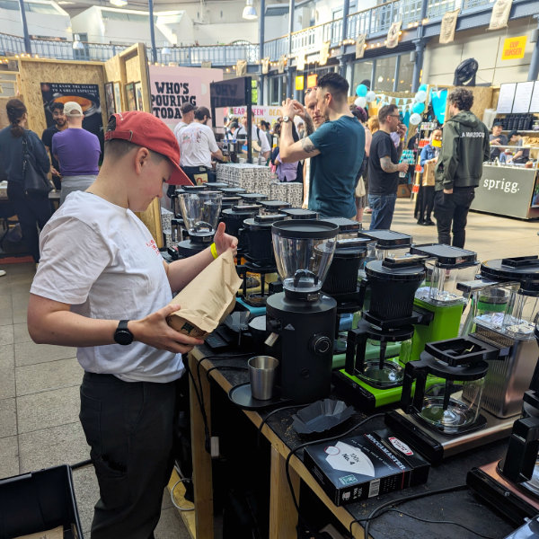 Image of barista grinding coffee for the Roast Hero event