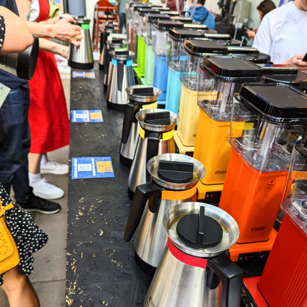 Line up of brightly coloured Moccamasters at the Glasgow Coffee Festival