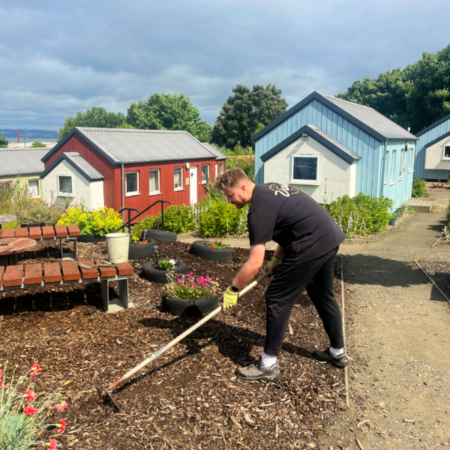 Matthew Algie employee volunteering at the Social Bite Village and doing some gardening