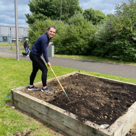 Matthew Algie employee volunteering at the Social Bite Village and doing some gardening