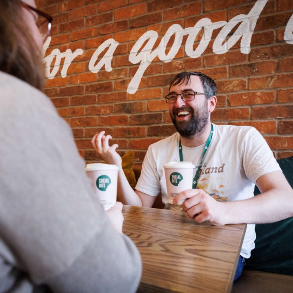 Social Bite social worker, Euan Brock meeting with a service user for a coffee