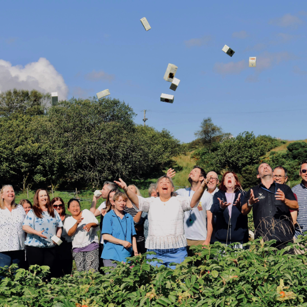 Throwing Island Bakery biscuits into the air in celebration of national biscuit day